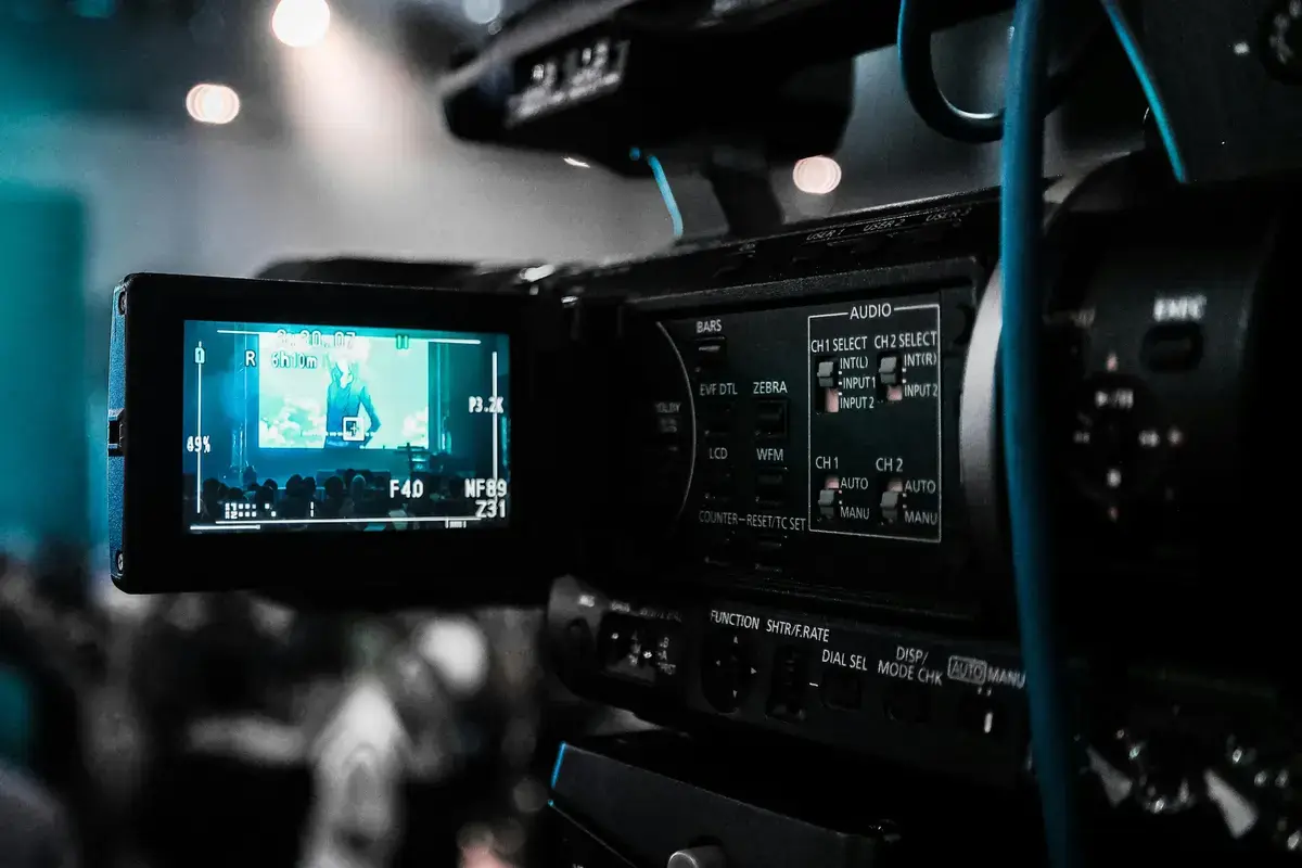 TV show recording studio with professional lighting rigs, multiple camera setups, and production equipment
